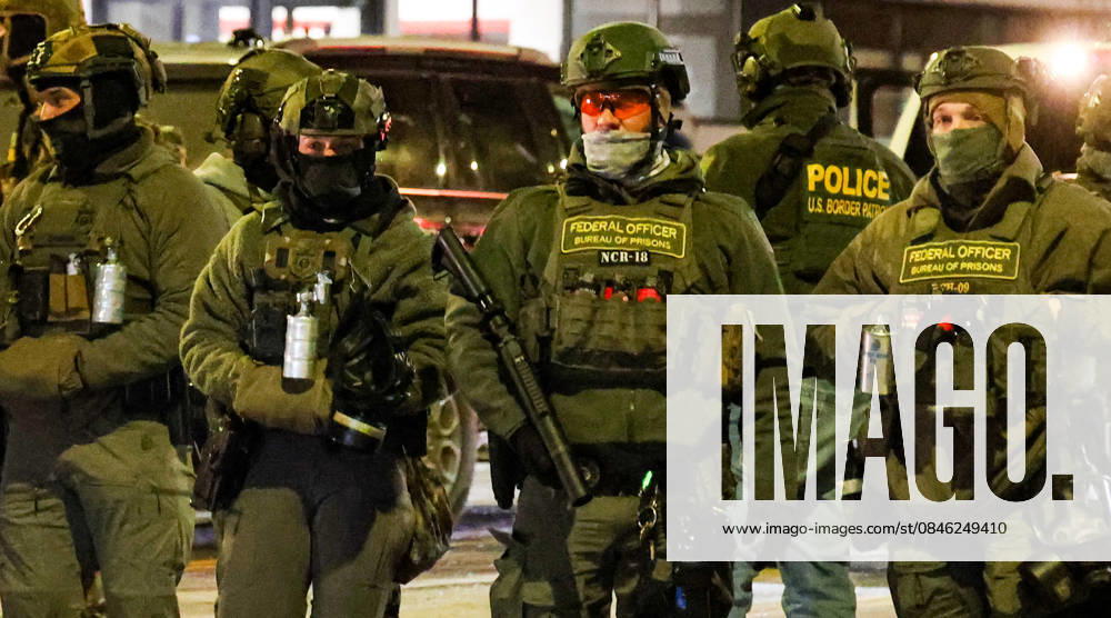 A group of less than 30 people consisting of as many Press as Protestors holding a â€oeNoise Protest†outside the Home 2 Hilton Hotel near the University of Minneapolis because they got wind some ICE agents were staying there in an neighborhood heavy with young college students were met with and vastly out numbered by aggressive ICE agents and Federal Bureau of Corrections agents in full tactical attack gear. The one in charge violently pushed a Photojournalist to the ground who was filming an arrest of his friend, a former CNN correspondent; threatened and blinded another photographer with flashlights and headlights, and mocked them, showing shocking rudeness and unprofessionalism. By the ti - ZUMAk144 20260125_znp_k144_051