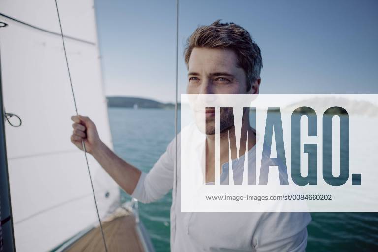 Portrait of a man on a sailing boat model released Symbolfoto JLOF00070