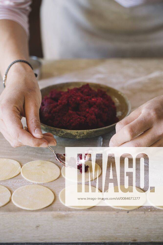 Woman preparing ravioli, beetroot sage filling model released Symbolfoto ALBF00502