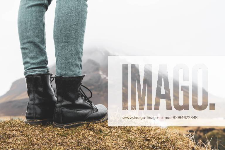 Iceland, legs of woman standing on hill model released Symbolfoto KKAF00998