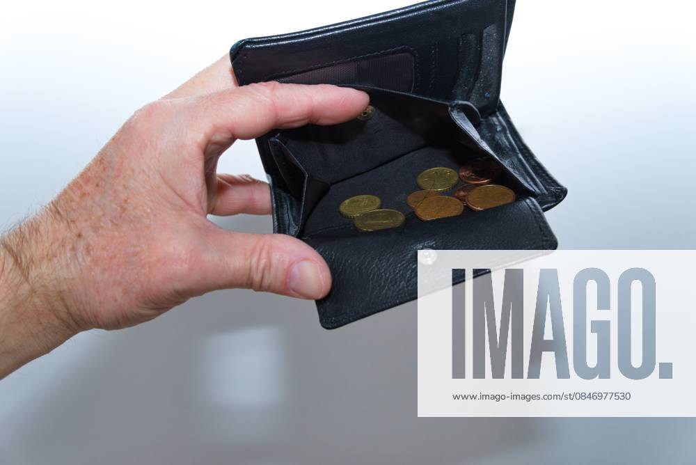 Hand holds almost Empty Wallet at Symbol image for Lack of money 1077406550