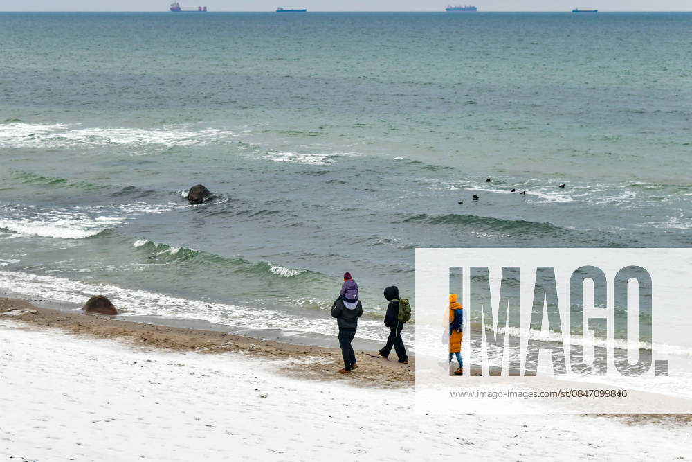 Baltic Sea in winter People walking on the wintry Baltic Sea beach at the Wilhelmshöhe near Warnemünde Warnemünde Mecklenburg Western Pomerania Germany JK15318