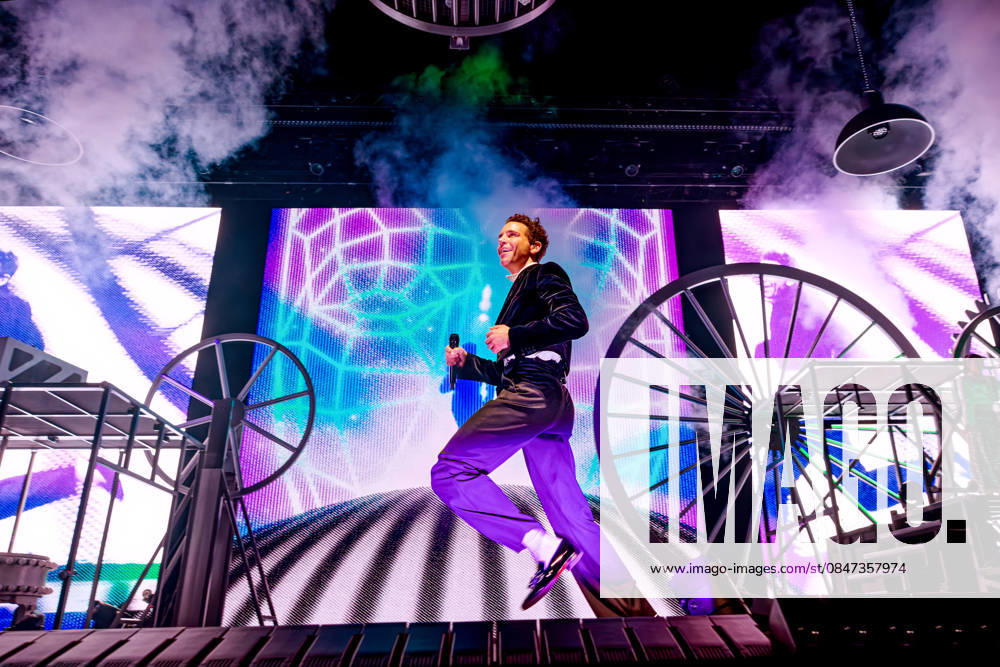 Mika (MICHAEL HOLBROOK PENNIMAN JR) performs on stage at the AO Arena, Manchester, UK, during his Spinning Out tour, delivering a flamboyant, high-energy set to a packed arena crowd. Manchester United Kingdom - ZUMAp211 20260211_aap_p211_010