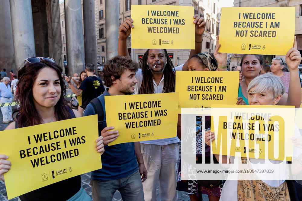Amnesty International hold flashmob for World Refugee Day ROME, ITALY - JUNE 20: Activists of human rights organization Amnesty International hold in front of the Pantheon during a flashmob on World Refugee Day on June 20, 2017 in Rome, Italy. Amnesty International calls on the international community to take concrete action to support the protection of refugees, activate safe channels and mobility opportunities and create an alternative to dangerous irregular crossings. Rome Italy