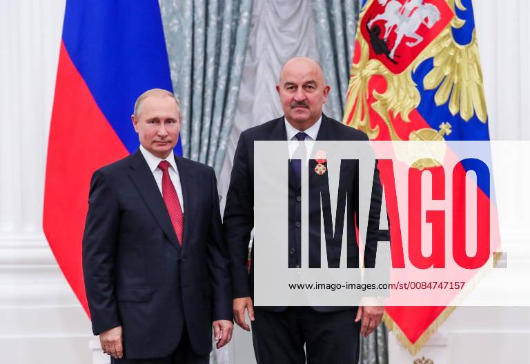 MOSCOW, RUSSIA â€“ JULY 28, 2018: Russia s President Vladimir Putin (L) awards head coach Stanislav Cherchesov an Order of Alexander Nevsky at a ceremony to present state decorations certificates of merit to Russian men s national football team players and coaches following the 2018 FIFA World Cup at the Moscow Kremlin. Mikhail Klimentyev Russian Presidential Press and Information Office TASS TS08B13C