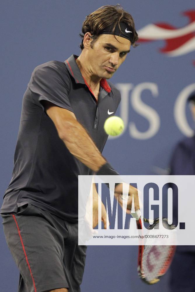 Roger Federer of Switzerland hits backhand in his match on day in Arthur Ashe Stadium at the U.S. Open Tennis Championships Stadium at the Billie Jean King National Tennis Center in New York City on August 29, 2011. NYP20110829140