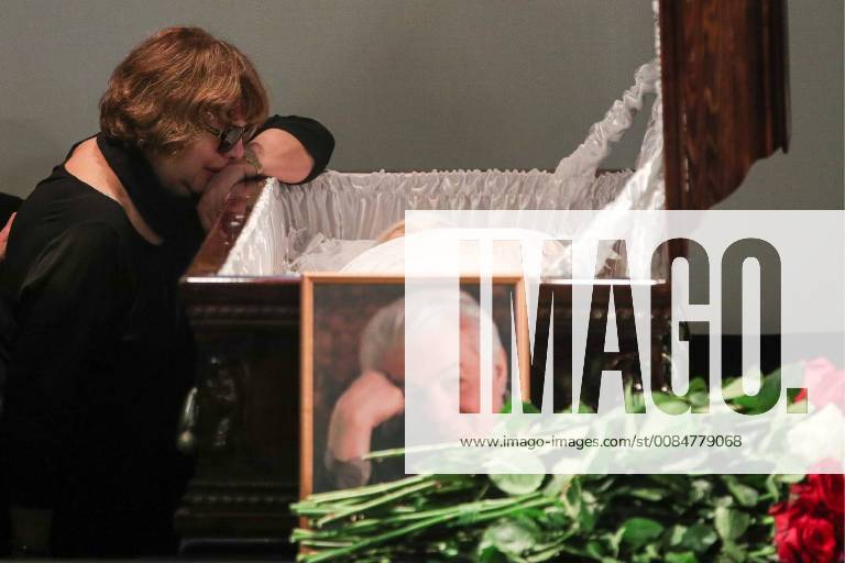 Widow Svetlana Kolesnichenko of Soviet and Russian writer Vladimir Voinovich pays her last respects for her deceased husband during a farewell ceremony at the Central House of Writers in central Moscow. Sergei Bobylev TASS TS08B42A