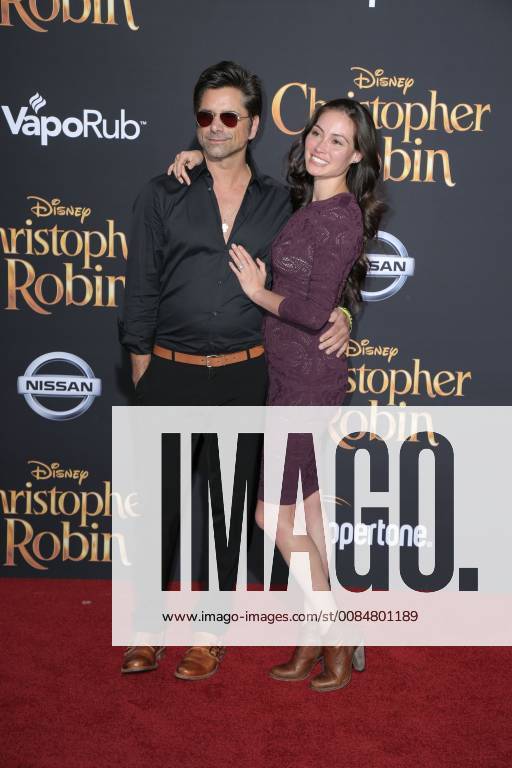 U.S. - 30 July 2018 - Burbank, California - John Stamos, Caitlin McHugh. Premiere of Disney s Christopher Robin held at Walt Disney Studios. Photo Credit: PMA AdMedia U.S. - ZUMAa123 20180730_zaa_a123_216