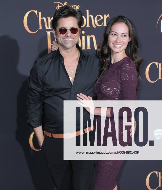 U.S. - 30 July 2018 - Burbank, California - John Stamos, Caitlin McHugh. Premiere of Disney s Christopher Robin held at Walt Disney Studios. Photo Credit: PMA AdMedia U.S. - ZUMAa123 20180730_zaa_a123_254