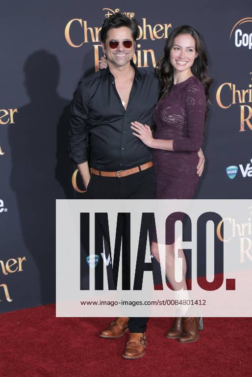 U.S. - 30 July 2018 - Burbank, California - John Stamos, Caitlin McHugh. Premiere of Disney s Christopher Robin held at Walt Disney Studios. Photo Credit: PMA AdMedia U.S. - ZUMAa123 20180730_zaa_a123_258