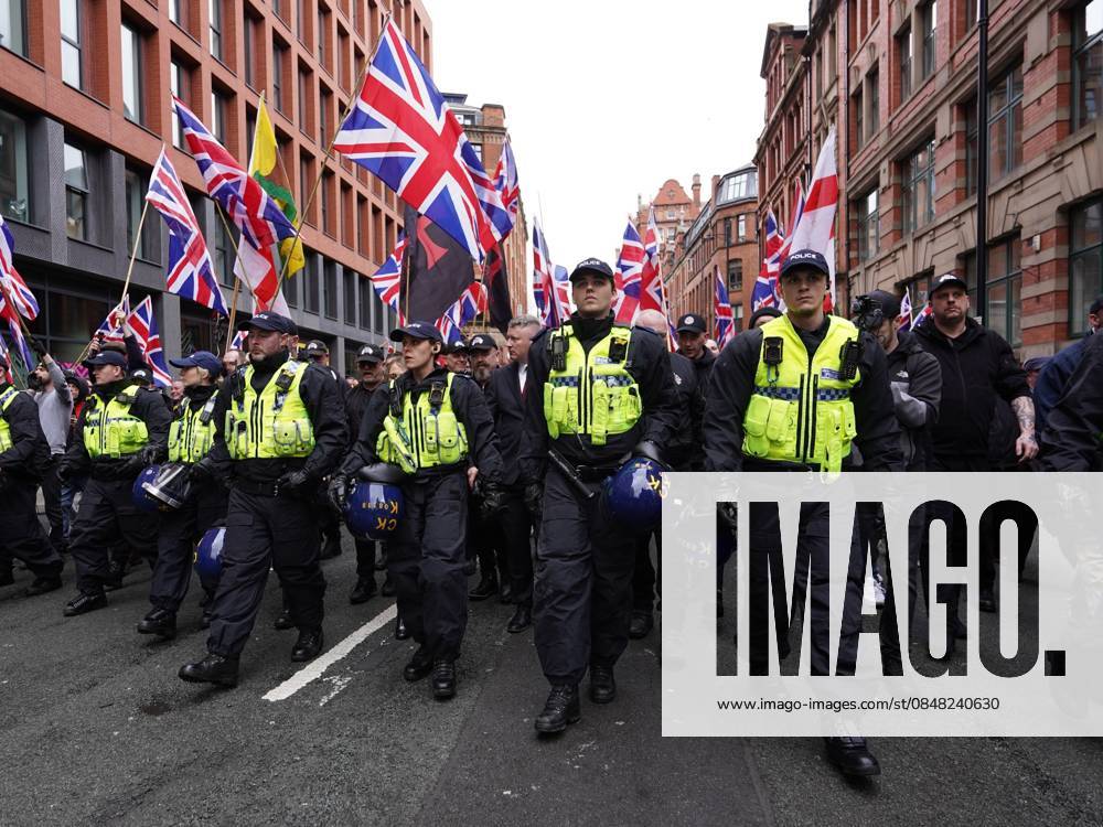 Britain First March For Remigration in Manchester MANCHESTER , UNITED KINGDOM - FEBRUARY 21: Police clash with protestors during an anti-migration protest as they demand mass deportation in Manchester, United Kingdom, on 21 February, 2026. Loannis Alexopoulos Anadolu Manchester United Kingdom. Editorial use only. Please get in touch for any other usage.