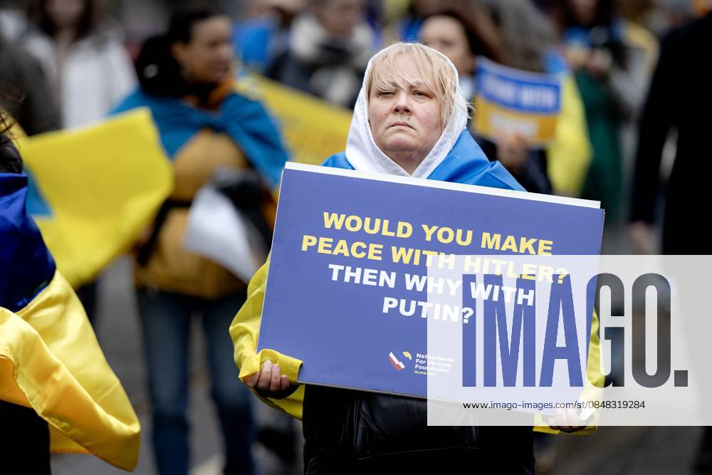 AMSTERDAM Participants in a solidarity march for Ukraine walk from Museumplein to Dam Square, where a commemoration ceremony was held. February 24 marks the fourth anniversary of Russia s invasion of Ukraine. RAMON VAN FLYMEN ANP netherlands out - belgium out