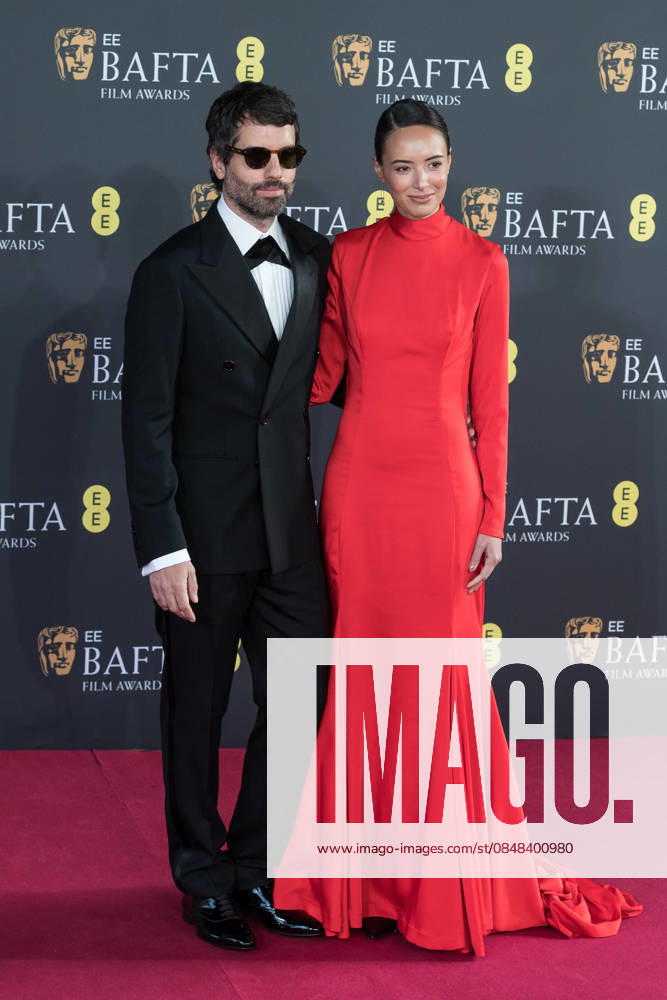 ADOLPHO VELOSO and ANA GABRIELA attend the red carpet during the EE BAFTA Film Awards 2026 ceremony at The Royal Festival Hall. London United Kingdom - ZUMAs371 20260222_zip_s371_325