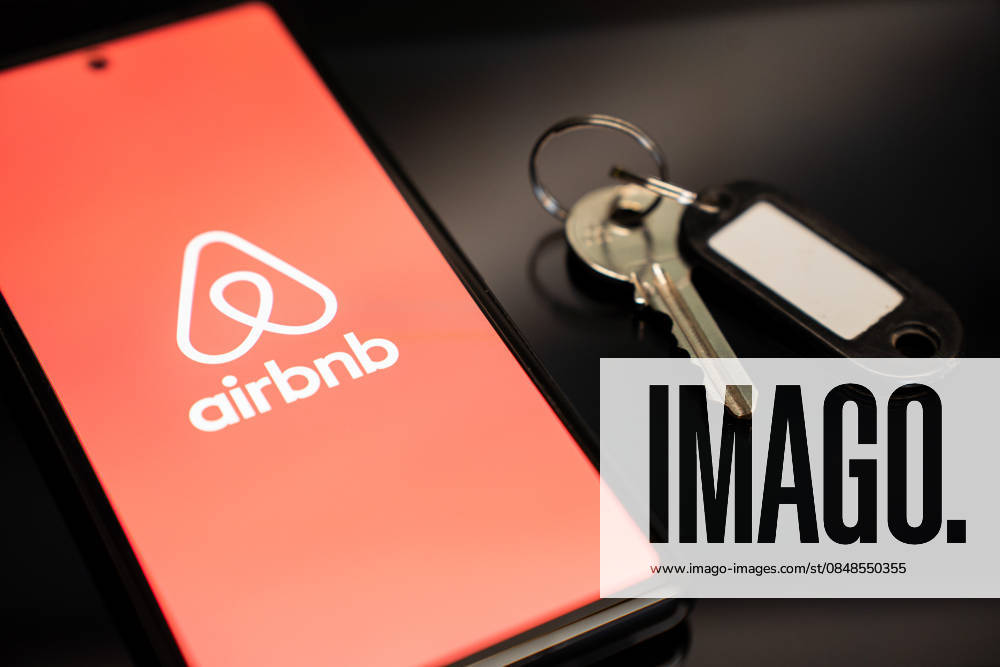 Airbnb Platform Photo Illistrations The Airbnb logo appears on a mobile phone screen next to a key in Athens, Greece, on February 24, 2026. Athens Greece