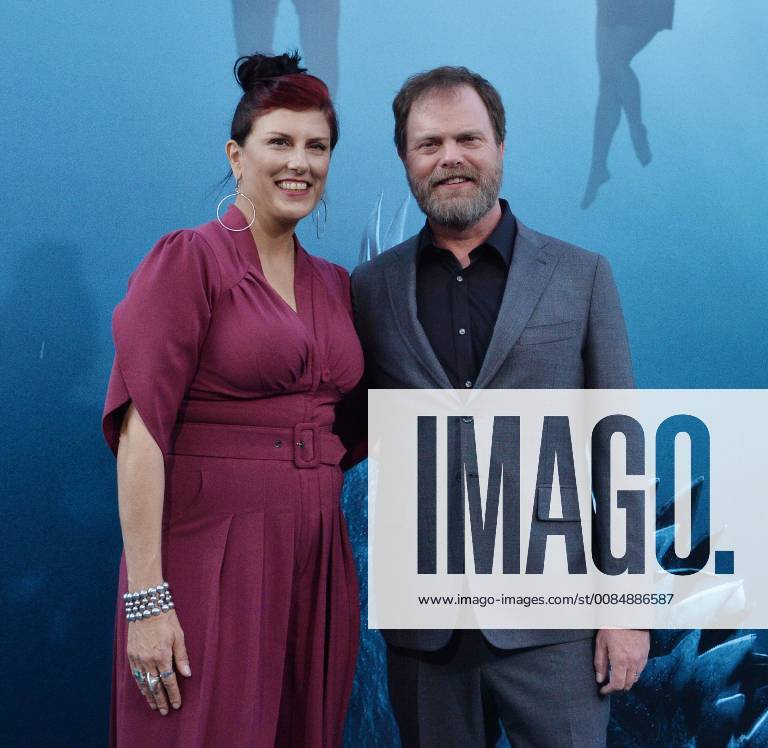 Cast member Rainn Wilson and his wife, American fiction writer Holiday Reinhorn attend the premiere of the sci-fi motion picture thriller The Meg at TCL Chinese Theatre in the Hollywood section of Los Angeles on August 6, 2018. Storyline: After escaping an attack by what he claims was a 70-foot shark, Jonas Taylor must confront his fears to save those trapped in a sunken submersible. LAP2018080644 JIMxRUYMEN
