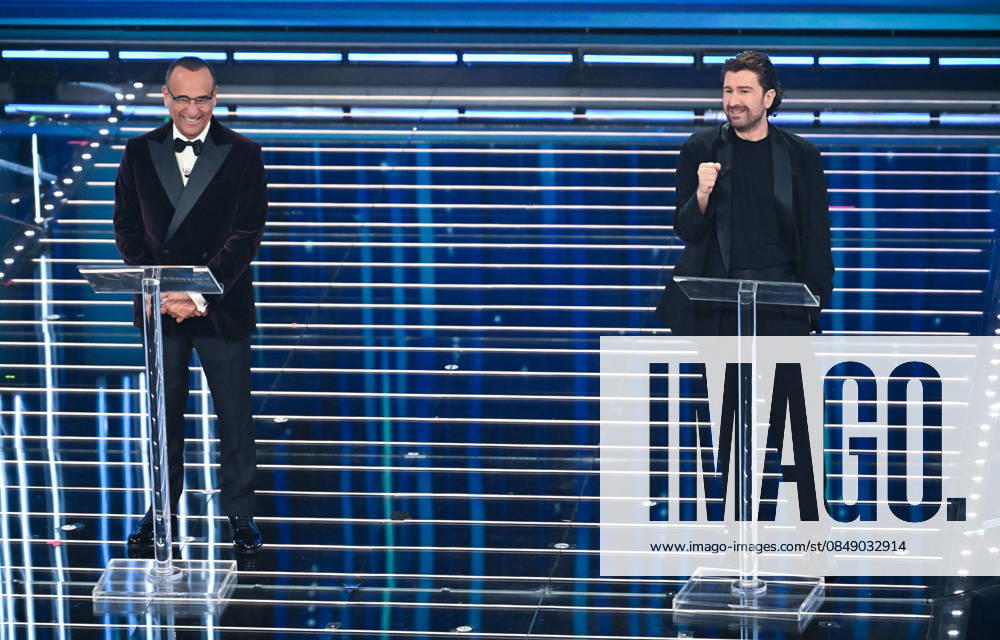 (L-R) Sanremo Festival host and artistic director Carlo Conti with Italian actor Alessandro Siani on stage at the Ariston theatre during the 76th edition of the Sanremo Italian Song Festival, in Sanremo, Italy, 27 February 2026. The music festival will run from 24 to 28 February 2026. ANSA RICCARDO ANTIMIANI. Sanremo Italy - ZUMAa110 20260227_zaf_a110_120