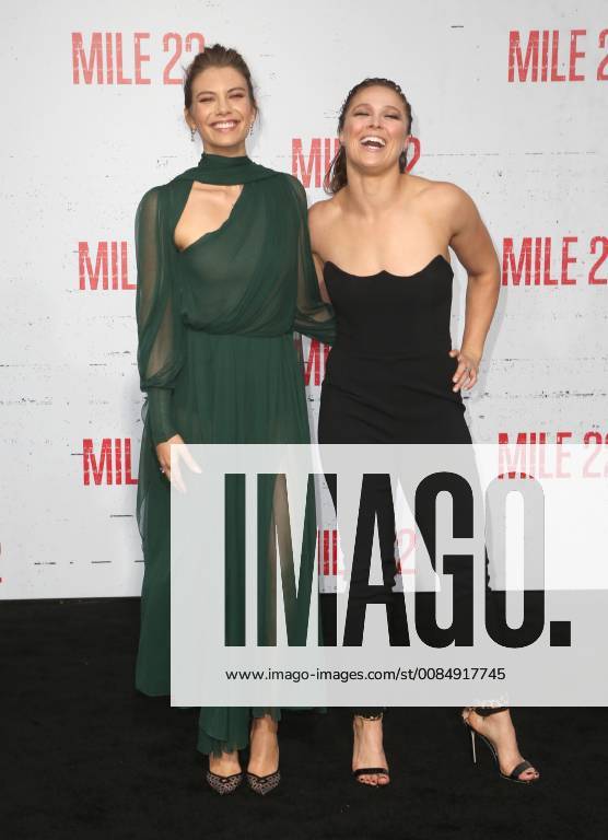 LOS ANGELES, CA - AUGUST 9: Lauren Cohan and Ronda Rousey at the Mile 22 premiere at The Regency Village Theatre in Los Angeles, California on August 9, 2018.