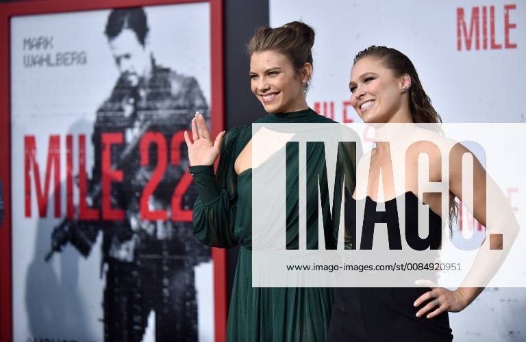 Lauren Cohan (L) and Ronda Rousey attend the premiere of Mile 22 at the Westwood Village Theater in Los Angeles, California on August 9, 2018. LAP20180809842 CHRISxCHEW