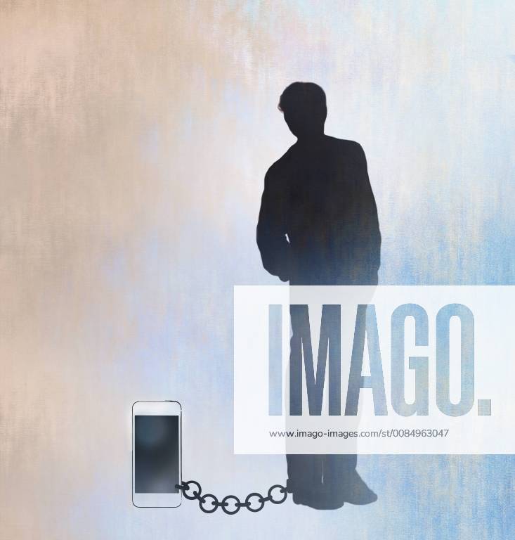 Mann an sein Smartphone gekettet