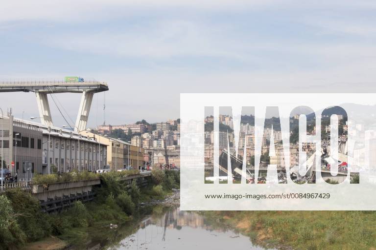 Genoa, Liguria, Italy - The remains of the Morandi motorway bridge stands after it partially collapsed in Genoa, Italy, on Tuesday, Aug. 14, 2018. The famous bridge of highway A10 that connected the Liguria region with south Italy collapsed with many victims. Genoa Italy - ZUMAn230 20180814_zaa_n230_286
