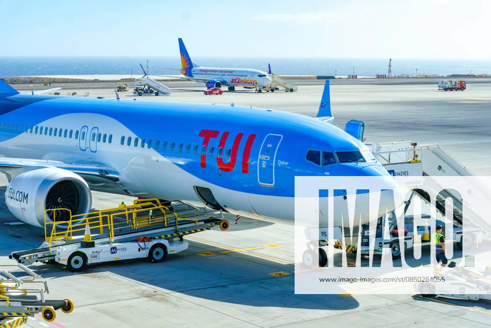 Santa Cruz, Tenerife, Canary Islands, Spain TUI aircraft Boeing 737 Max 8 Dakar G TUPD is ready for boarding Aeropuerto de Tenerife Sur TFS Behind is a Jet2Holiday aircraft Santa Cruz de Tenerife Tenerife Spain