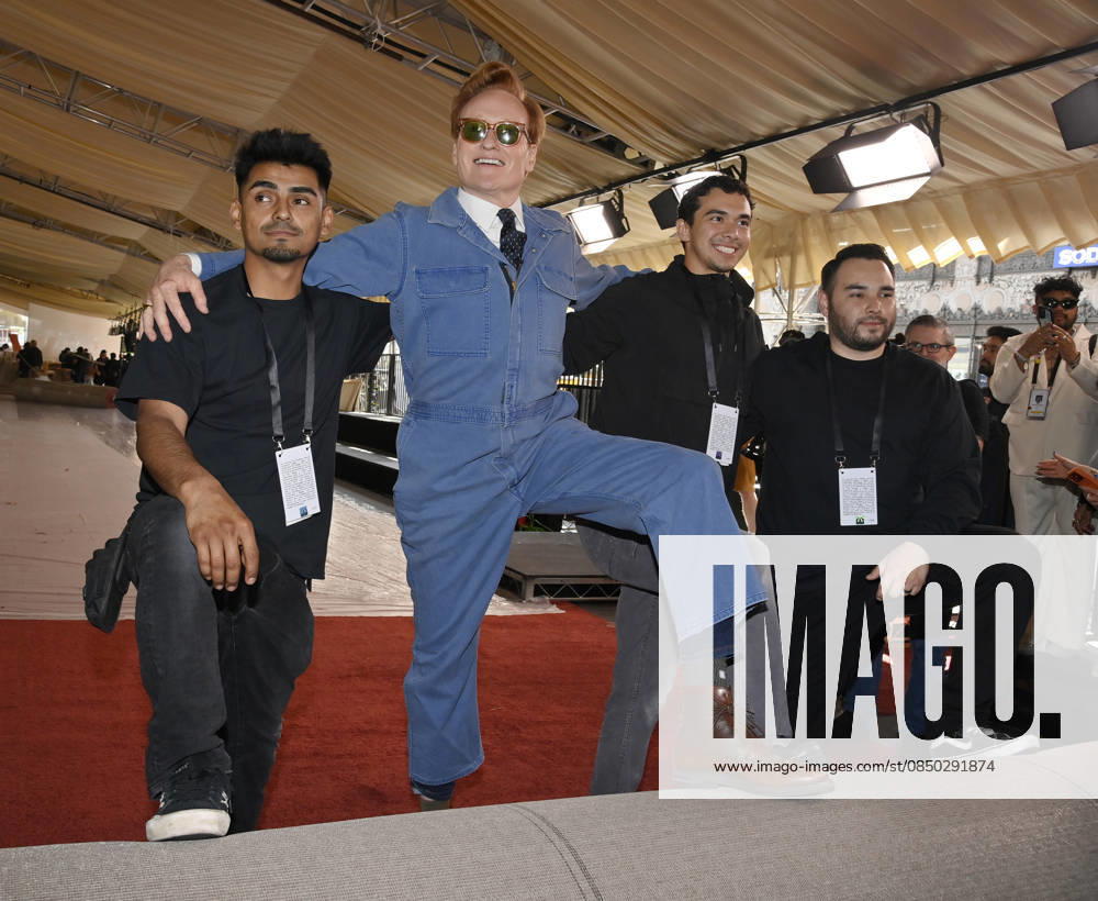 Conan O Brien strikes a pose with the crew during the 98th annual Academy Awards red carpet roll out at Ovation Hollywood in Los Angeles on Wednesday, March 11, 2026. O Brien will host the Oscars for the second consecutive year, airing live on March 15 on ABC. LAP2026031128 JIMxRUYMEN