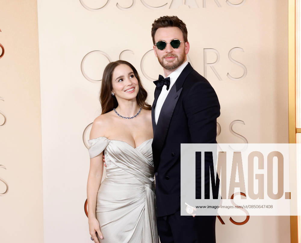 (L-R) Alba Baptista and Chris Evans attend the 98th Oscars on the red carpet for the 98th annual Academy Awards in the Hollywood section of Los Angeles on Sunday, March 15, 2026. Conan O Brien will host the Oscars for the second consecutive year. LAP20260315664 JOHNxANGELILLO