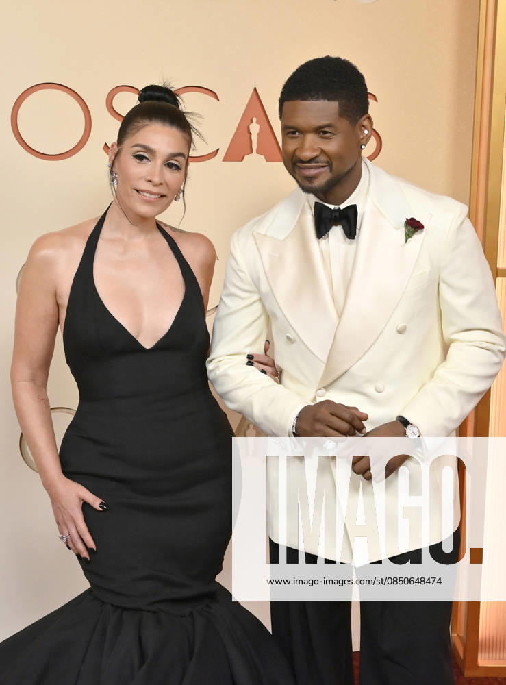 Jennifer Goicoechea and Usher arrive on the red carpet for the 98th annual Academy Awards in the Hollywood section of Los Angeles on Sunday, March 15, 2026. Conan O Brien will host the Oscars for the second consecutive year. LAP20260315218 JIMxRUYMEN