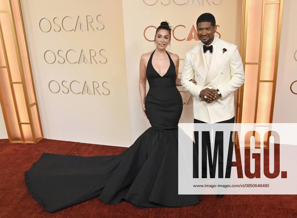 Jennifer Goicoechea and Usher arrive on the red carpet for the 98th annual Academy Awards in the Hollywood section of Los Angeles on Sunday, March 15, 2026. Conan O Brien will host the Oscars for the second consecutive year. LAP20260315217 JIMxRUYMEN