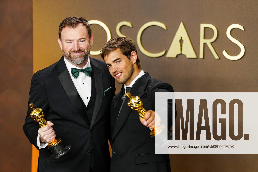 Sam A. Davis and Jack Piatt celebrate in the press photo room after winning the best Live Action Short Film Oscar for The Singers during the 98th annual Academy Awards in the Hollywood section of Los Angeles on Sunday, March 15, 2026. Conan O Brien is hosting the Oscars for the second consecutive year. LAP202603152309 BONNIExCASH