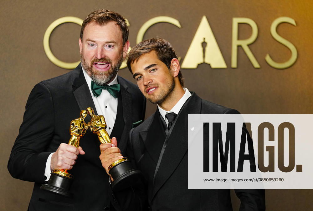 Sam A. Davis and Jack Piatt celebrate in the press photo room after winning the best Live Action Short Film Oscar for The Singers during the 98th annual Academy Awards in the Hollywood section of Los Angeles on Sunday, March 15, 2026. Conan O Brien is hosting the Oscars for the second consecutive year. LAP202603152311 BONNIExCASH