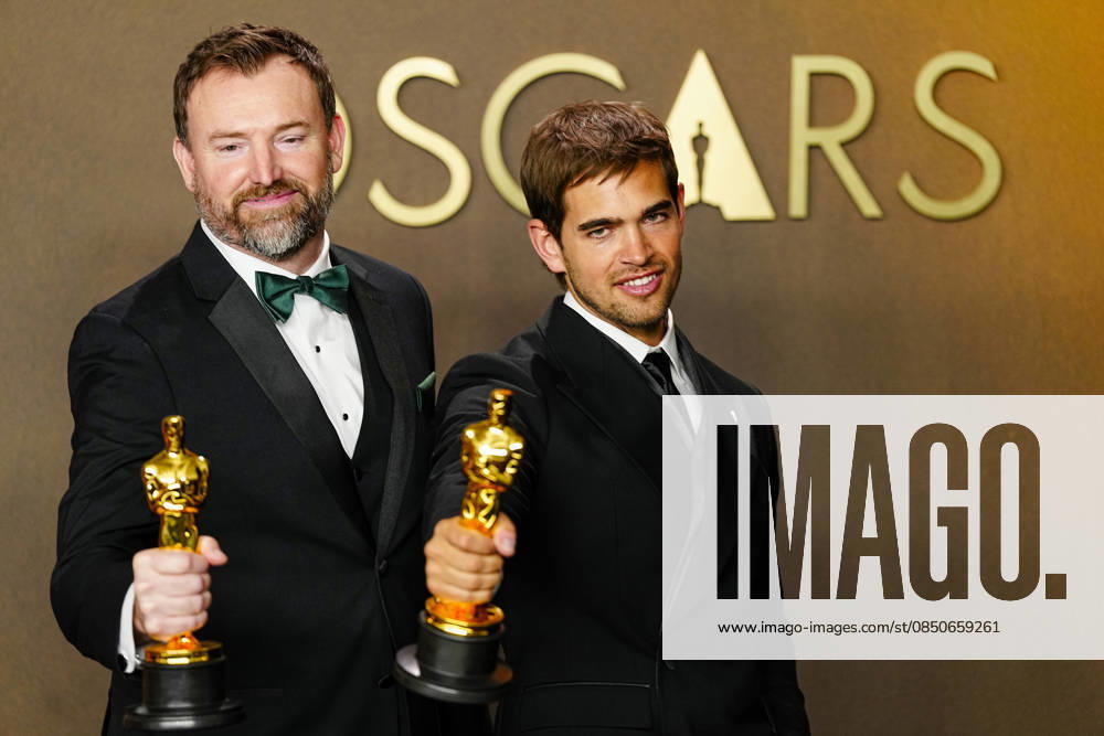 Sam A. Davis and Jack Piatt celebrate in the press photo room after winning the best Live Action Short Film Oscar for The Singers during the 98th annual Academy Awards in the Hollywood section of Los Angeles on Sunday, March 15, 2026. Conan O Brien is hosting the Oscars for the second consecutive year. LAP202603152312 BONNIExCASH
