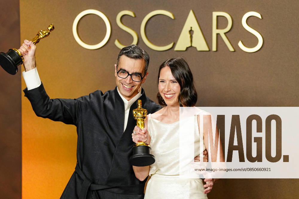 Natalie Musteata and Alexander Singh celebrate in the press photo room after winning the Best Live Action Short Film Oscar for Two People Exchanging Saliva during a tie with Sam A. Davis and Jack Piatt in the 98th annual Academy Awards in the Hollywood section of Los Angeles on Sunday, March 15, 2026. Conan O Brien is hosting the Oscars for the second consecutive year. LAP20260315353 BONNIExCASH