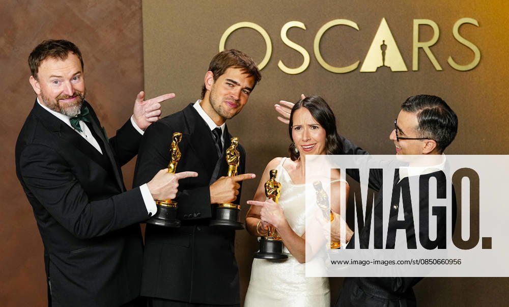 Natalie Musteata and Alexander Singh celebrate in the press photo room after winning the Best Live Action Short Film Oscar for Two People Exchanging Saliva during a tie with Sam A. Davis and Jack Piatt for The Singer in the 98th annual Academy Awards in the Hollywood section of Los Angeles on Sunday, March 15, 2026. Conan O Brien is hosting the Oscars for the second consecutive year. LAP20260315361 BONNIExCASH