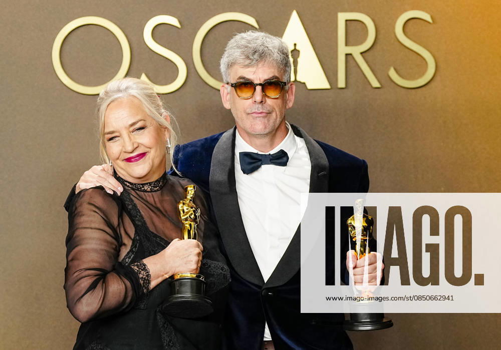 Tamara Deverell and Shane Vieau celebrate in the press photo room after winning the Best Production Design Oscar for Frankenstein during the 98th annual Academy Awards in the Hollywood section of Los Angeles on Sunday, March 15, 2026. LAP20260315369 BONNIExCASH