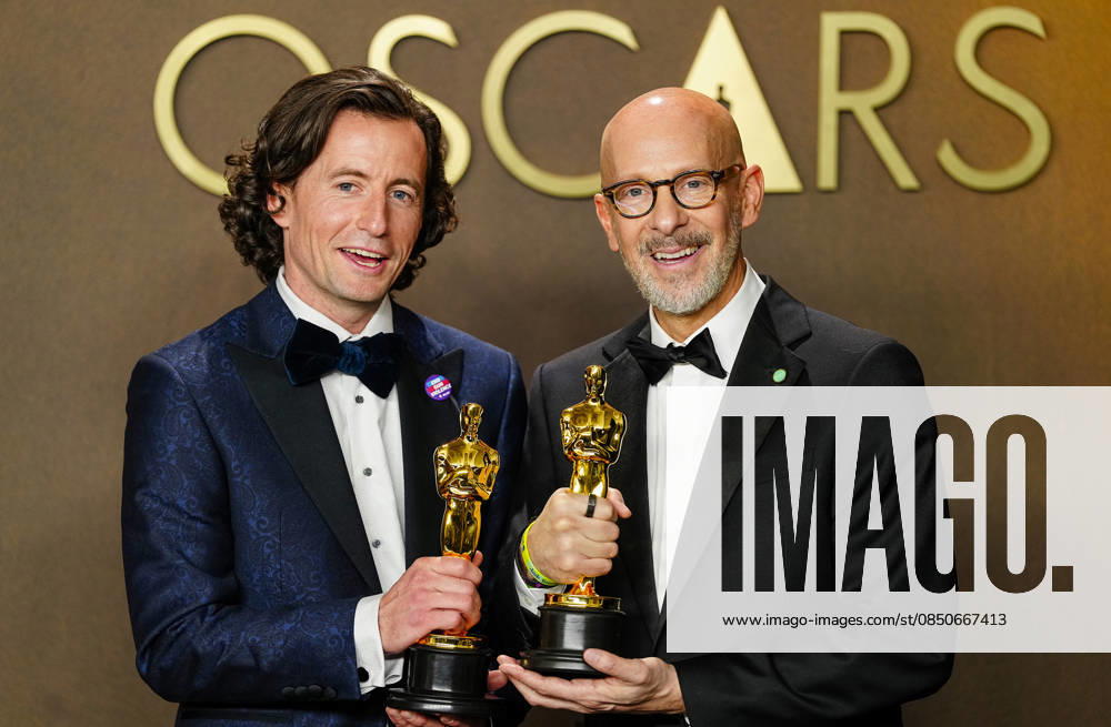 Conall Jones and Joshua Seftel celebrate in the press photo room after winning the Best Documentary Short Film Oscar for All the Empty Rooms during the 98th annual Academy Awards in the Hollywood section of Los Angeles on Sunday, March 15, 2026. LAP2026031537176 BONNIExCASH