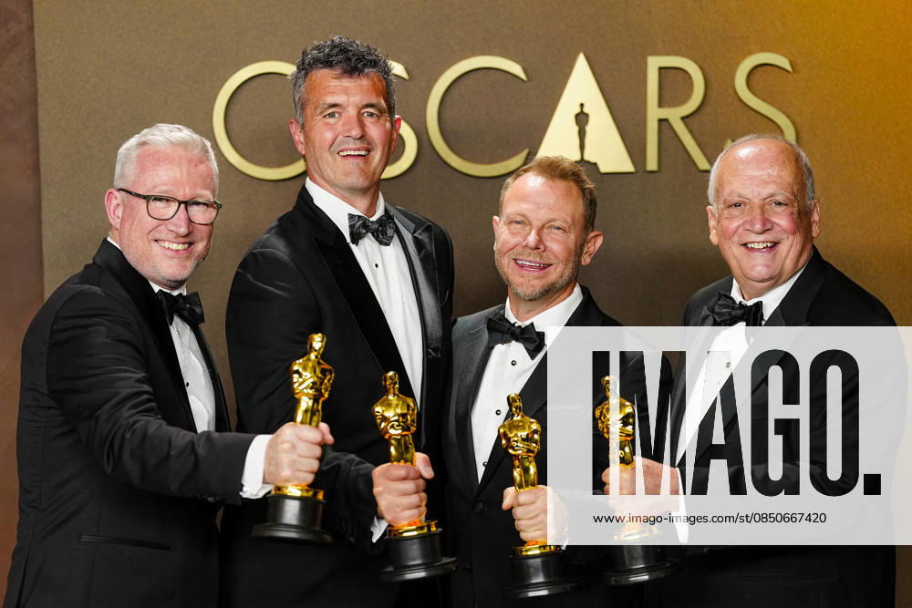 Richard Baneham, Joe Letteri, Daniel Barrertt, and Eric Saindon celebrate in the press photo room after winning the Best Visual Effects Oscar for Avatar: Fire and Ash during the 98th annual Academy Awards in the Hollywood section of Los Angeles on Sunday, March 15, 2026. LAP20260315375 BONNIExCASH