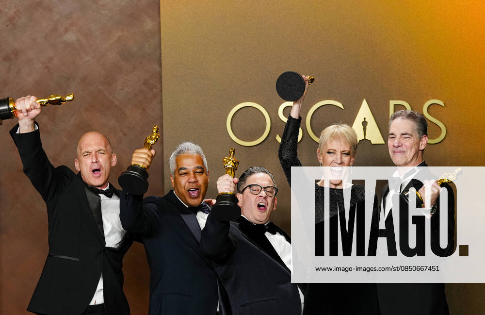 Gareth John, Al Nelson, Gwendolyn Yates Whittle, Gary A. Rizzo, and Juan Peralta celebrate in the press photo room after winning the Best Sound Oscar for F1 during the 98th annual Academy Awards in the Hollywood section of Los Angeles on Sunday, March 15, 2026. LAP20260315384 BONNIExCASH