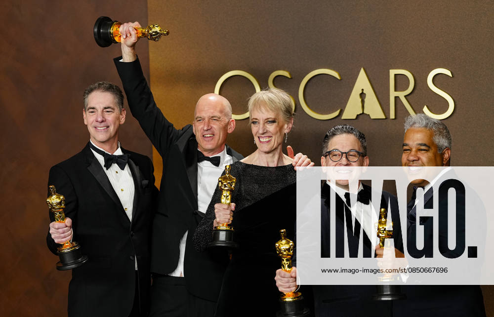 Gareth John, Al Nelson, Gwendolyn Yates Whittle, Gary A. Rizzo, and Juan Peralta celebrate in the press photo room after winning the Best Sound Oscar for F1 during the 98th annual Academy Awards in the Hollywood section of Los Angeles on Sunday, March 15, 2026. LAP20260315382 BONNIExCASH