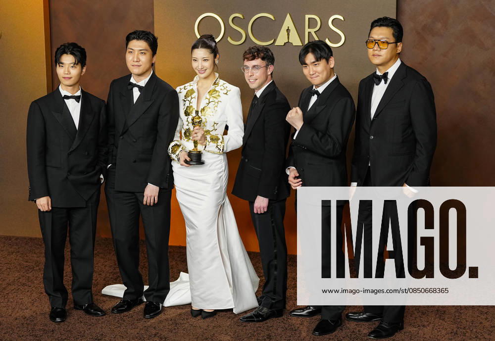EJAE, Mark Sonnenblick, Joong Gyu Kwak, Yu Han Lee, Hee Dong Nam, Jeong Hoon Seo, and Teddy Park celebrate in the press photo room after winning the Best Original Song Oscar for Golden from KPop Demon Hunters during the 98th annual Academy Awards in the Hollywood section of Los Angeles on Sunday, March 15, 2026. LAP20260315393 BONNIExCASH