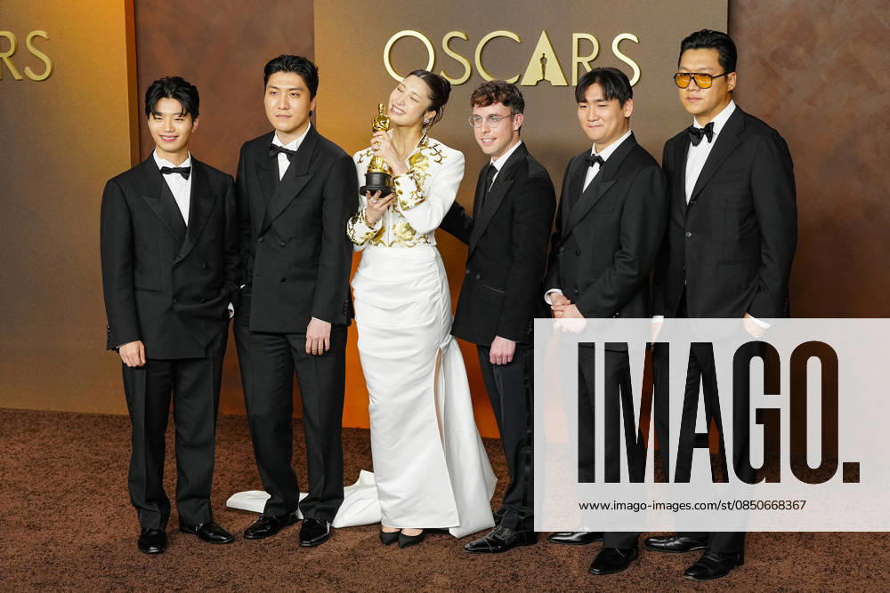 EJAE, Mark Sonnenblick, Joong Gyu Kwak, Yu Han Lee, Hee Dong Nam, Jeong Hoon Seo, and Teddy Park celebrate in the press photo room after winning the Best Original Song Oscar for Golden from KPop Demon Hunters during the 98th annual Academy Awards in the Hollywood section of Los Angeles on Sunday, March 15, 2026. LAP20260315394 BONNIExCASH