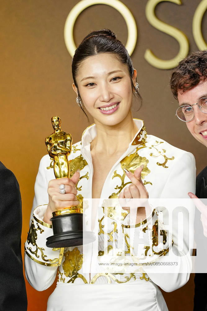 EJAE, Mark Sonnenblick, Joong Gyu Kwak, Yu Han Lee, Hee Dong Nam, Jeong Hoon Seo, and Teddy Park celebrate in the press photo room after winning the Best Original Song Oscar for Golden from KPop Demon Hunters during the 98th annual Academy Awards in the Hollywood section of Los Angeles on Sunday, March 15, 2026. LAP20260315396 BONNIExCASH