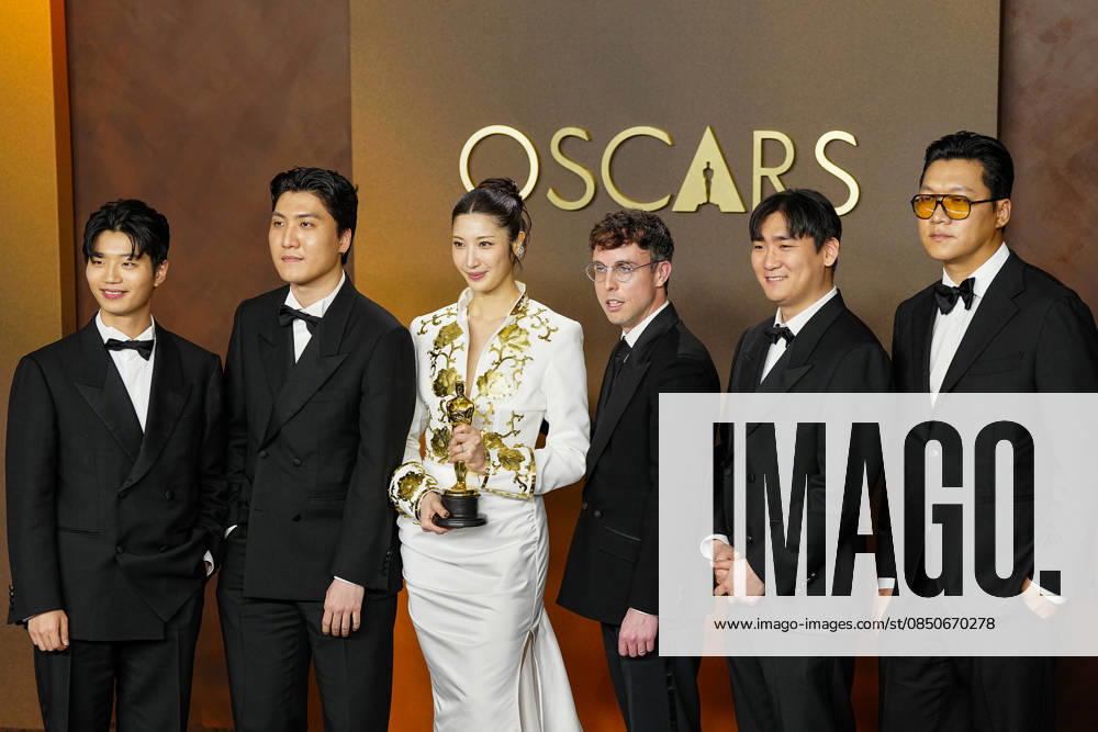 EJAE, Mark Sonnenblick, Joong Gyu Kwak, Yu Han Lee, Hee Dong Nam, Jeong Hoon Seo, and Teddy Park celebrate in the press photo room after winning the Best Original Song Oscar for Golden from KPop Demon Hunters during the 98th annual Academy Awards in the Hollywood section of Los Angeles on Sunday, March 15, 2026. LAP20260315397 BONNIExCASH