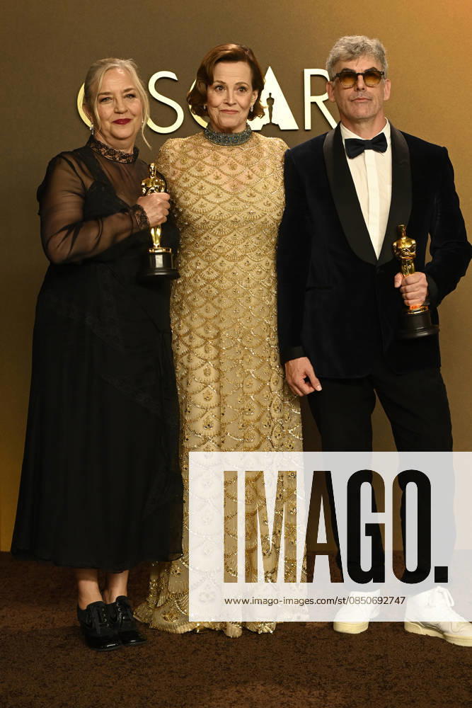 HOLLYWOOD, CA - MARCH 15: Tamara Deverell, Shane Vieau, Sigourney Weaver in the press room at the 98th Oscars at Dolby Theatre on March 15, 2026 in Hollywood, California.