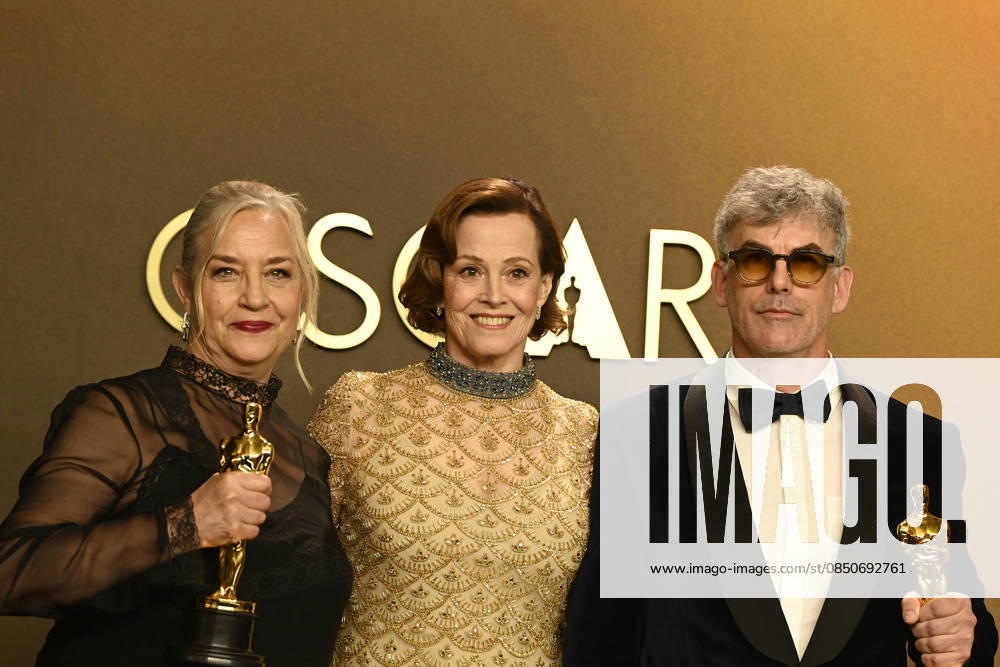 HOLLYWOOD, CA - MARCH 15: Tamara Deverell, Shane Vieau, Sigourney Weaver in the press room at the 98th Oscars at Dolby Theatre on March 15, 2026 in Hollywood, California.