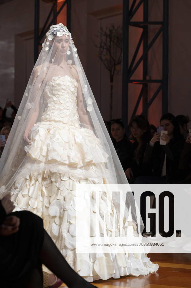 Telier Couture Fashion Week Madrid in Spain - 17 Mar 2026 A model walks the runway wearing a design by atelier couture during Fashion Week de Madrid in Fabric de Tapices. Madrid Spain
