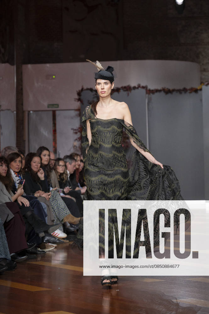 Telier Couture Fashion Week Madrid in Spain - 17 Mar 2026 A model walks the runway wearing a design by atelier couture during Fashion Week de Madrid in Fabric de Tapices. Madrid Spain