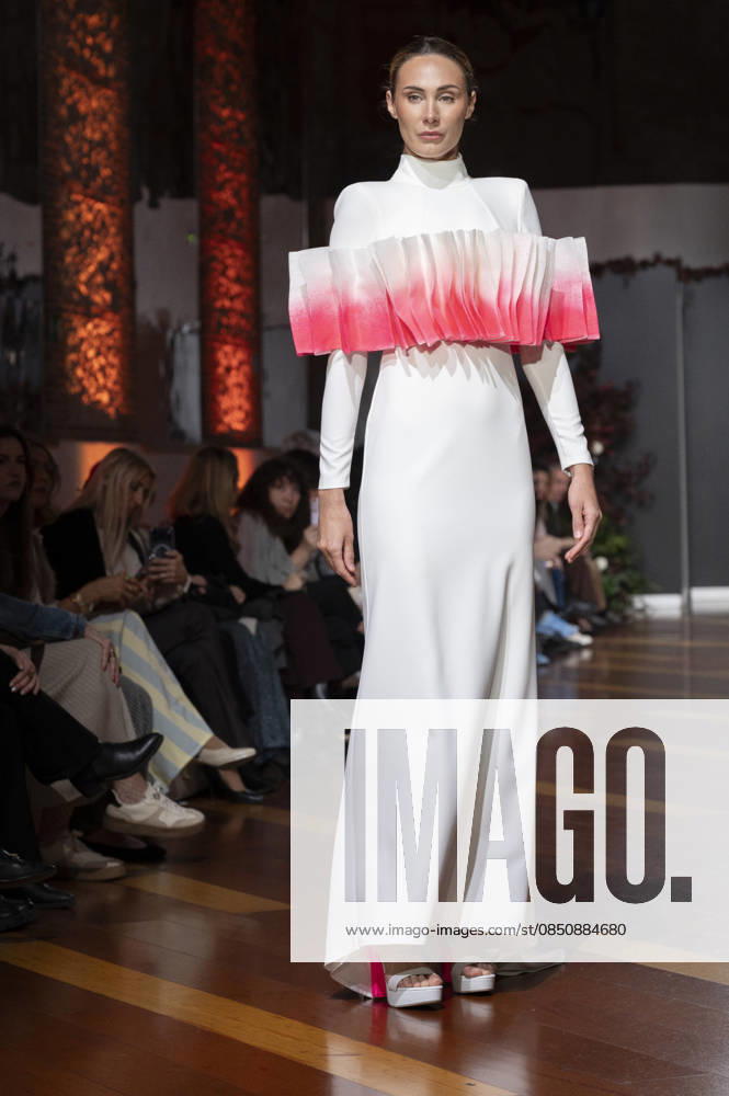 Telier Couture Fashion Week Madrid in Spain - 17 Mar 2026 A model walks the runway wearing a design by atelier couture during Fashion Week de Madrid in Fabric de Tapices. Madrid Spain
