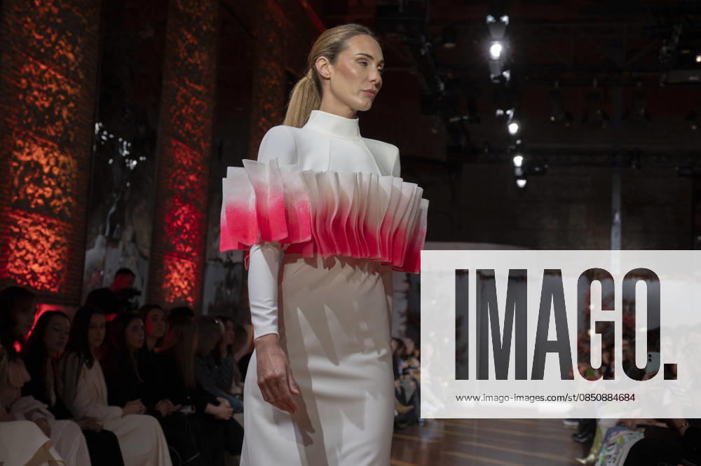 Telier Couture Fashion Week Madrid in Spain - 17 Mar 2026 A model walks the runway wearing a design by atelier couture during Fashion Week de Madrid in Fabric de Tapices. Madrid Spain