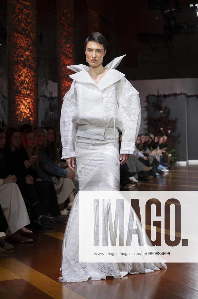 Telier Couture Fashion Week Madrid in Spain - 17 Mar 2026 A model walks the runway wearing a design by atelier couture during Fashion Week de Madrid in Fabric de Tapices. Madrid Spain